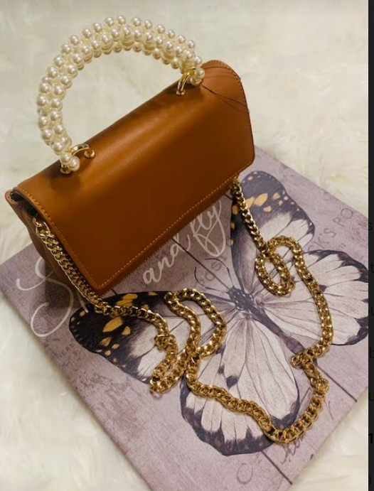 Gold Shoulder Handbag With Pearl Handle In Caramel Color